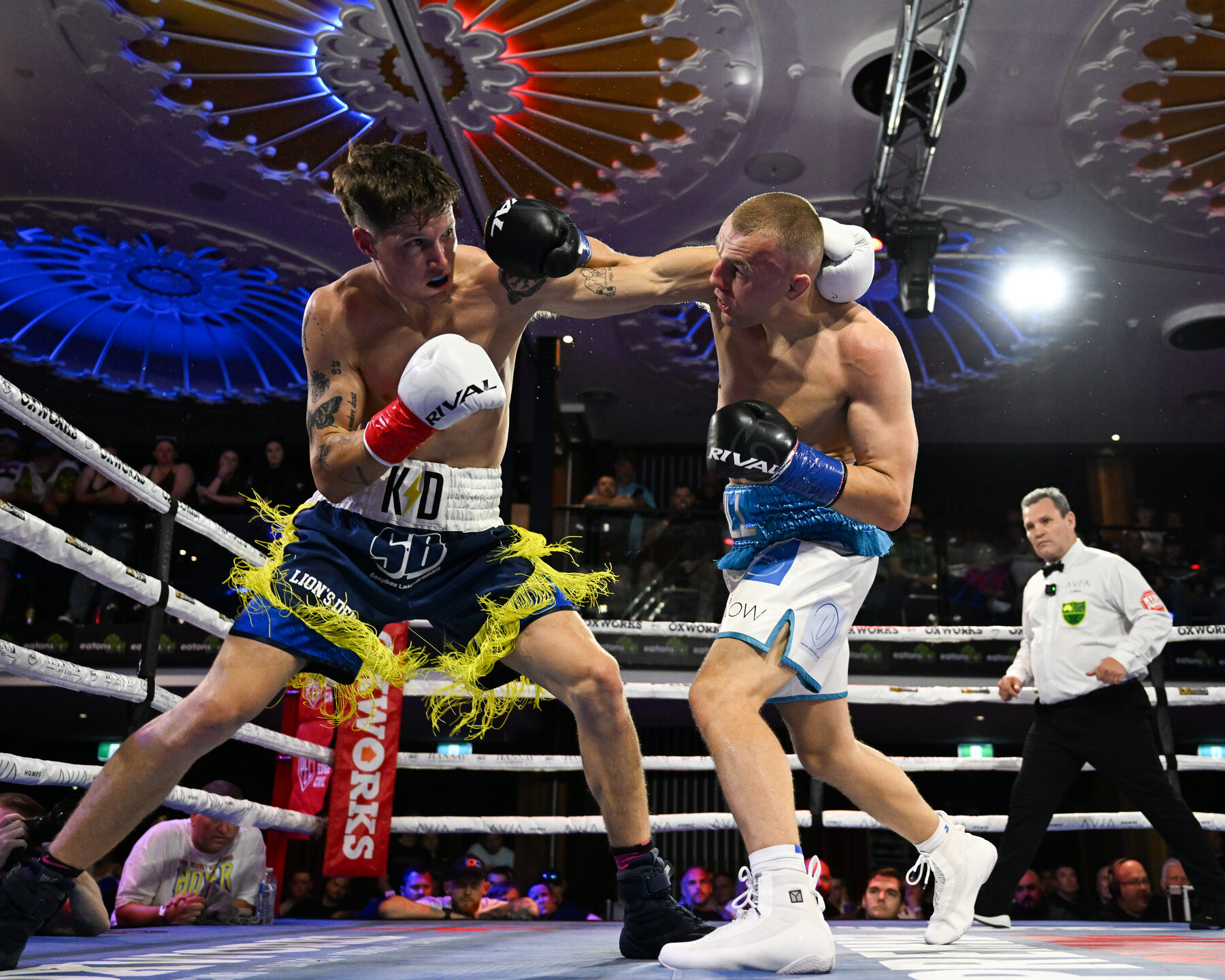 Mid-round exchange between fighters
